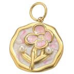 Gold pendant with pink floral design and pearls on a white background
