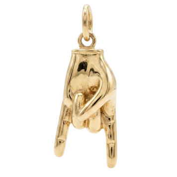 Gold pendant shaped like a hand on a white background